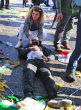 Image of A woman cries over a victim.