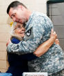 Image of Elizabeth Laird offers hugs to soldiers preparing to deploy (NBC).