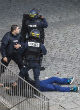 Image of SWAT and security forces raided a Saint-Denis apartment. Following the 6-hour firefight, two terrorists are dead and seven are in custody (AP).