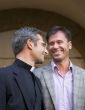 Image of Krzysztof Charamsa and his boyfriend Eduardo smile at each other after former-Vatican priest Charamsa admitted his sexual orientation.