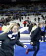Image of Soccer fans flee as suicide bombers detonate their vests outside the stadium. 