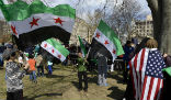 Image of Syrian immigrants protest in favor of allowing refugees into the country. Each year, thousands of Syrians enter the USA by perfectly legal means, but none are adequately screened for terrorist ties.