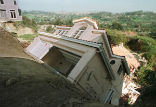 Image of A luxury home collapses in California in March, 1998.
