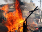 Image of A cross is burned in Pakistan during a spate of violence against Christians there.