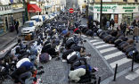 Image of Muslims take over a Parisian street for prayers. 