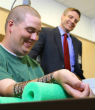 Image of Chip implant helps paralyzed man move arm and even play guitar (Screenshot/Ohio State University).