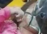 Image of Young girl dramatically rescued from debris.