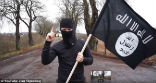 Image of Dressed a a terrorist and carrying a fake gun and ISIS flag, Vlad Tapes exposes a glaring hole in European border security. 