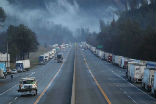 Image of A portion of the I-5 is closed as crews struggle with clearing snow from a mountain pass.