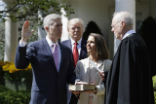 Image of Neil Gorsuch is sworn in at the White House rose garden.