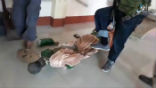 Image of Terrorists stomp and shatter a statue of a saint while ransacking a Catholic church in Mindanao. 