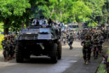 Image of President Duterte has declared martial law in the city, that was momentarily overrun by terrorists. As the terrorists are crushed and the citizens begin to return, the work rebuilding begins. 