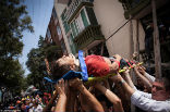Image of Rescuers move an injured man to safety. Over 800 people were seriously injured. Minor injuries were widespread.  