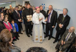Image of Bishop Burbige blesses the new clinic. 