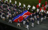 Image of North Korean athletes march under their own banner in the 2016 Olympics. In a few weeks, they will march under a unified banner with South Korea. 