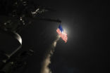 Image of A cruise missile is fired from a U.S. Navy ship during a previous strike on Syrian facilities. Another such strike appears imminent. 